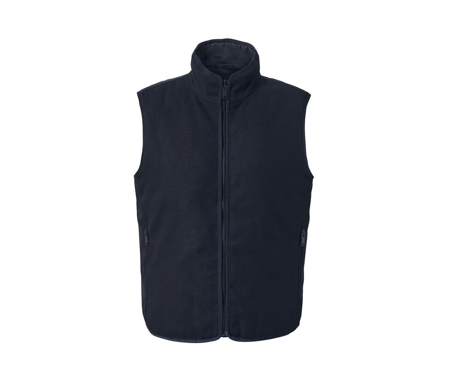 Une veste réversible bleu marine avec une fermeture éclair au milieu.