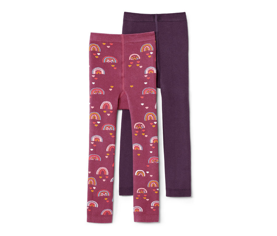 Deux leggings thermiques pour enfant, un avec un imprimé arc-en-ciel et cœur, l'autre rose baie.