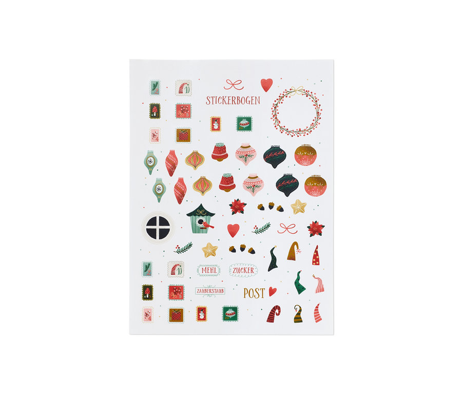 Une planche de stickers sur le thème de Noël, comprenant des boules de Noël, des sapins et des inscriptions.