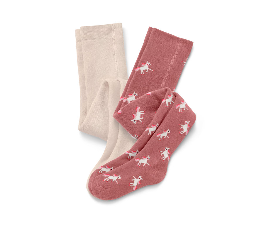 Deux collants thermiques pour enfants, un crème et un rose avec un imprimé de licornes.