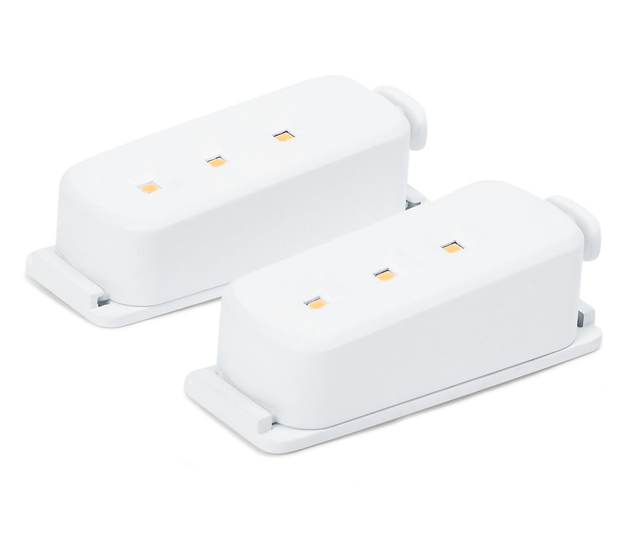 Deux modules électroniques blancs avec des LED sur fond blanc.