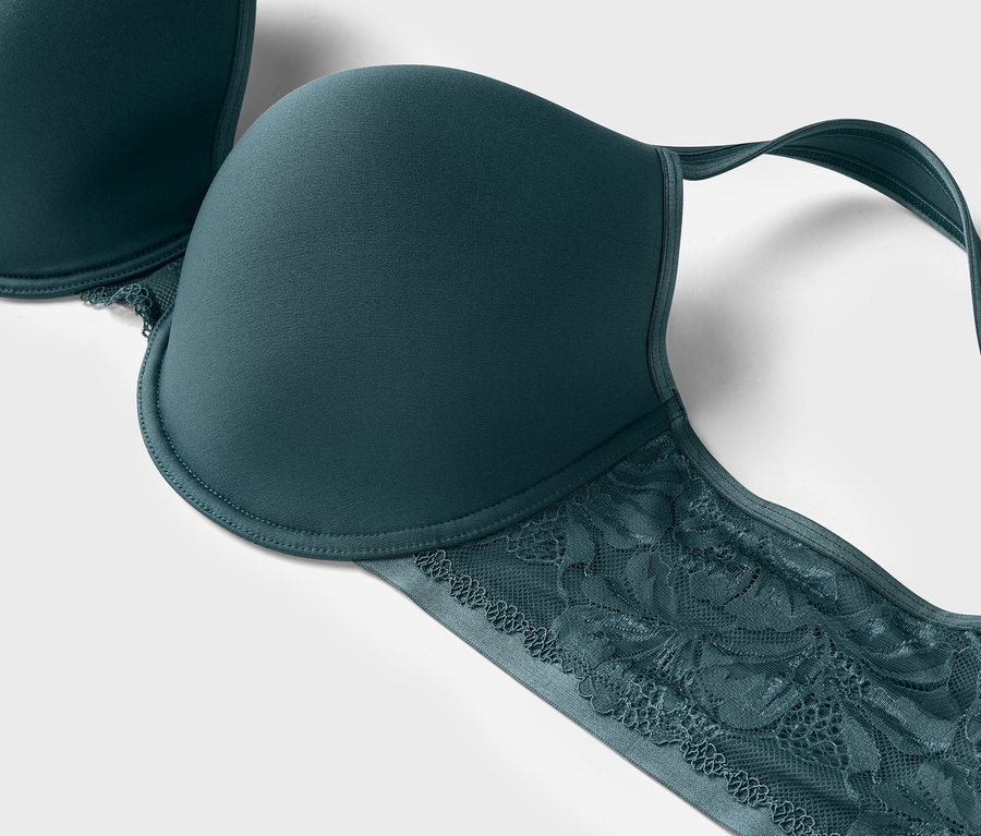 Gros plan d'un soutien-gorge vert avec bordure en dentelle.