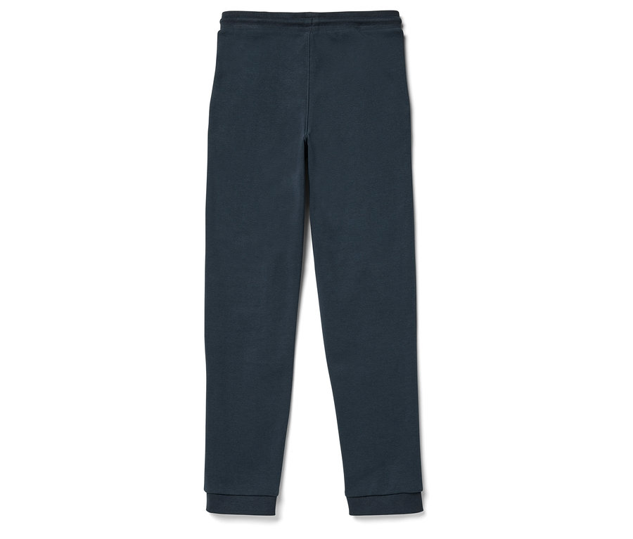 Un pantalon de jogging bleu marine posé sur un fond blanc.