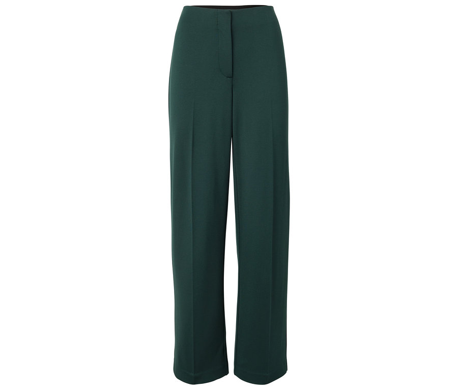 Pantalon vert large. Il a une fermeture éclair.