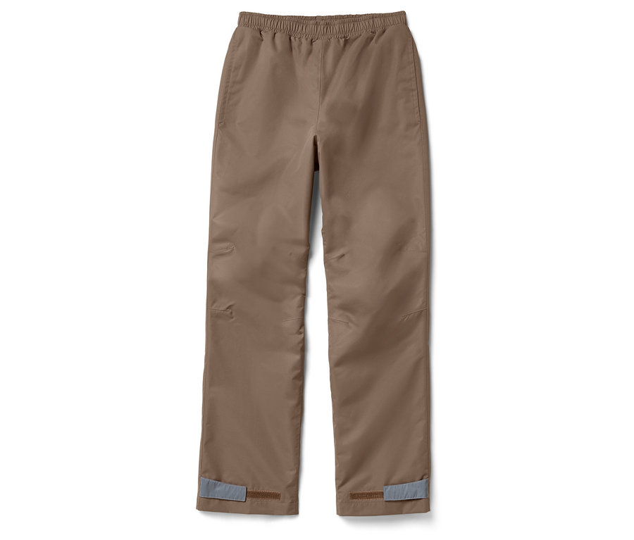 Un pantalon de pluie marron pour enfants posé sur un fond blanc.