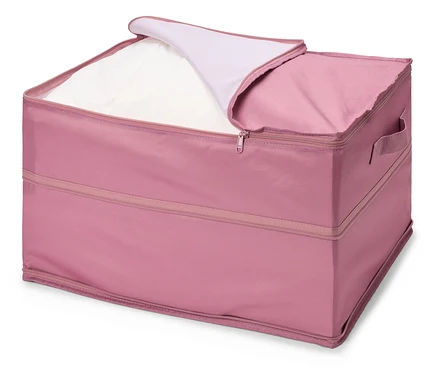 Boîte de rangement rose avec fermeture éclair partiellement ouverte et linge blanc à l'intérieur.