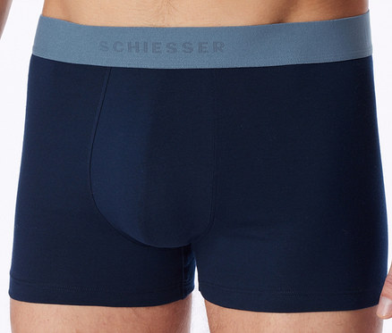 Boxer bleu marine avec une ceinture grise portant l'inscription "SCHIESSER", porté par un homme.