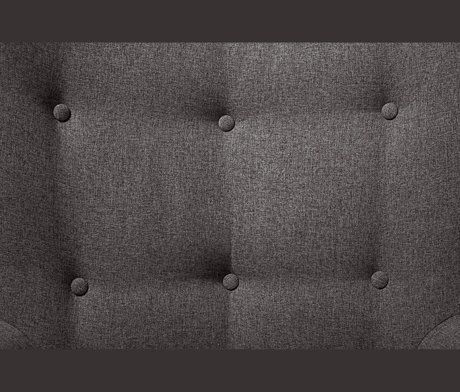 Gros plan sur le détail d'un fauteuil individuel gris foncé avec repose-pieds et boutons.