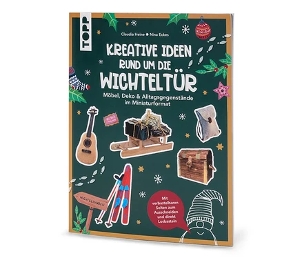 La couverture du livre « Kreative Ideen rund um die Wichteltür » montre des miniatures de meubles et de décorations sur un fond vert.