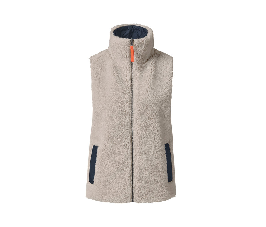 Un gilet réversible oversize beige avec une fermeture éclair orange et des détails bleu marine.
