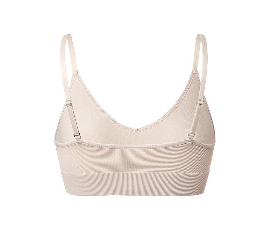 Vue arrière d'une brassière sans coutures beige avec bretelles réglables.