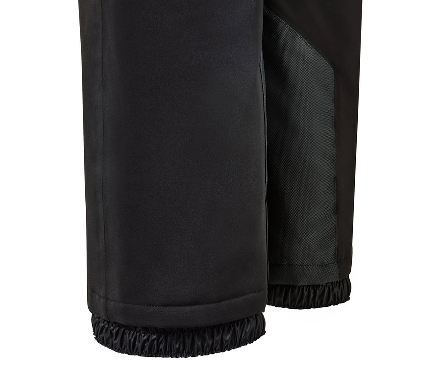 Gros plan sur un pantalon de ski noir taille haute.