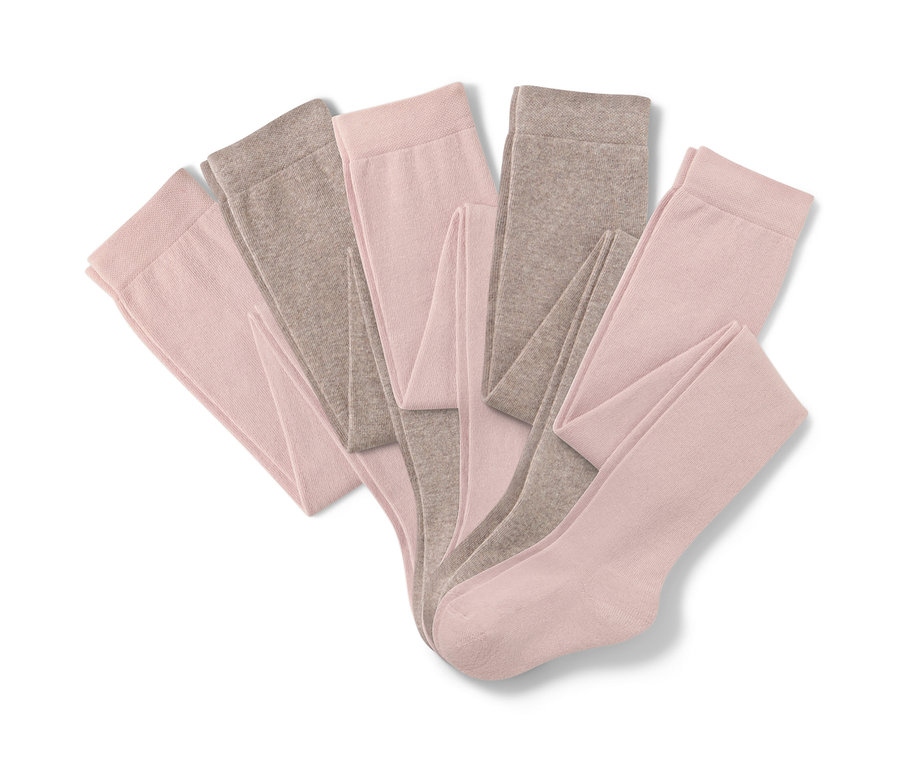 Cinq collants en coton, rose et marron.
