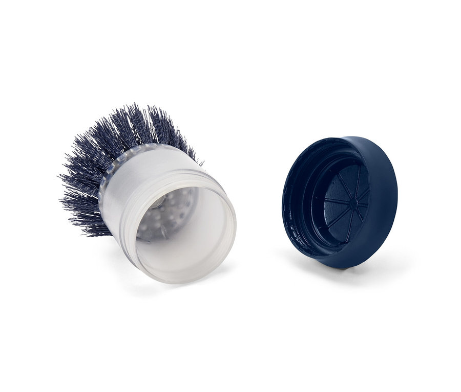 Une brosse avec distributeur et son couvercle posés sur un fond blanc.