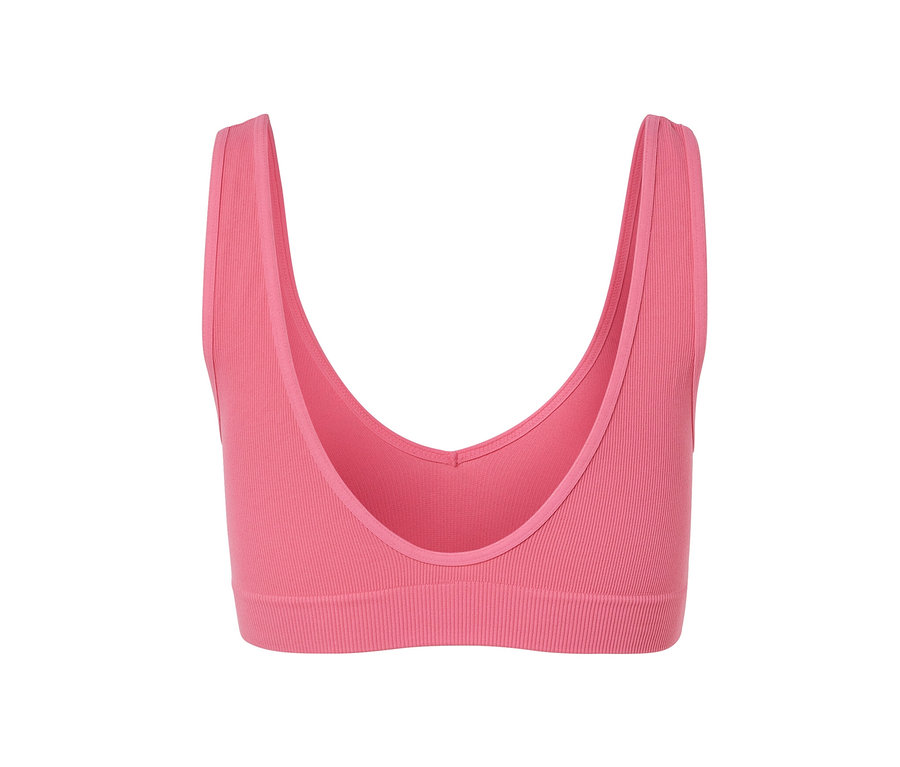 Gros plan d'une brassière rose sans coutures.