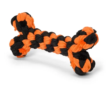 Un jouet pour chien en forme d'os noir et orange.