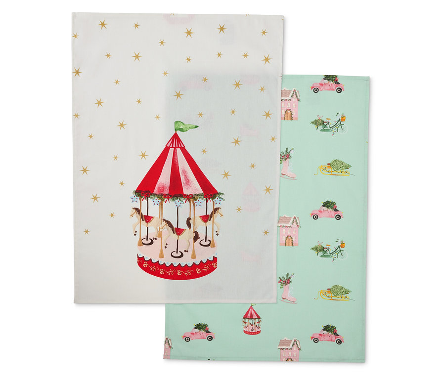 Deux torchons en tissu : un avec un carrousel, l'autre avec des motifs hivernaux.