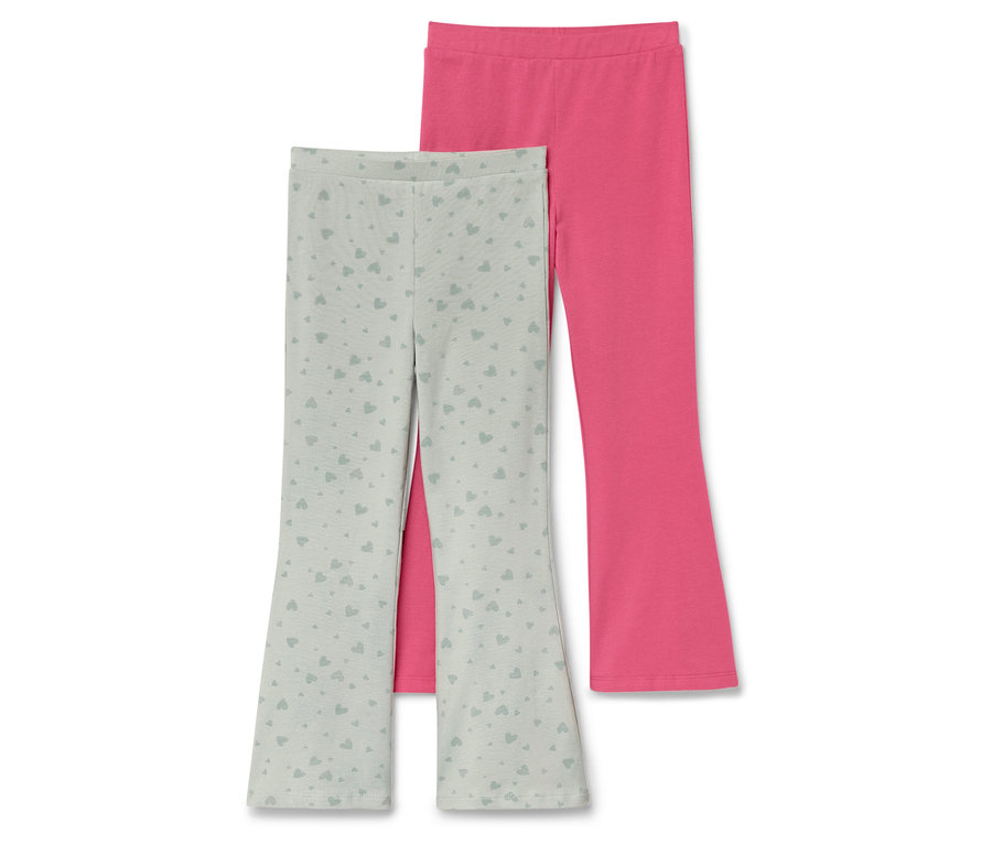 Deux leggings pour enfants : un vert clair avec un motif de cœurs et un rose.