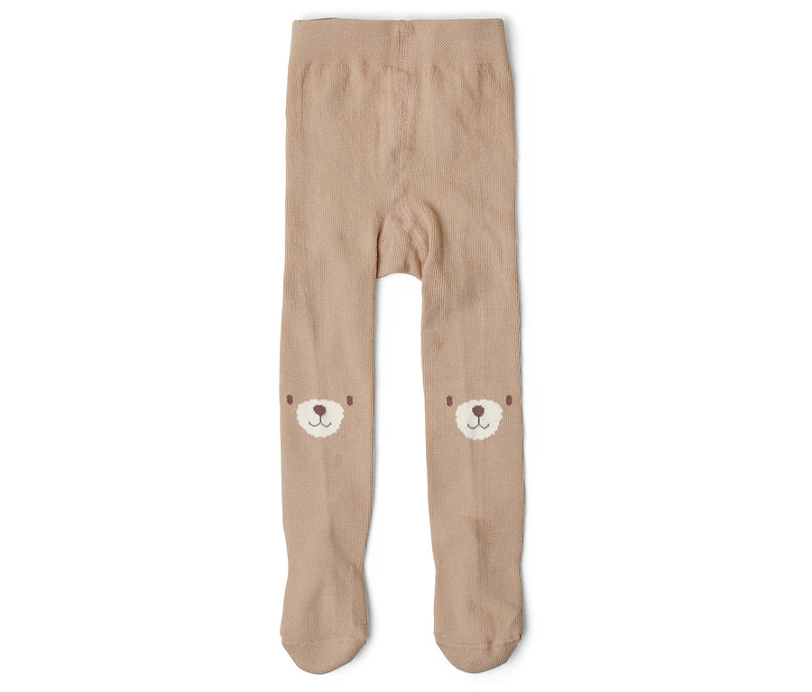 Collant beige pour enfant avec des têtes d'ours sur les genoux, posé à plat.