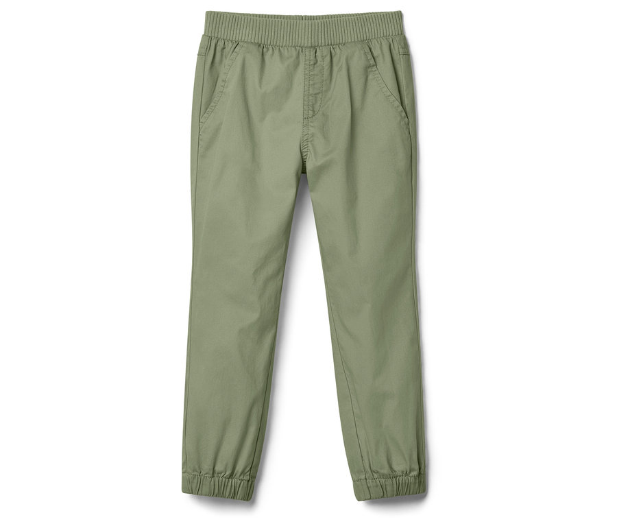Un pantalon vert olive avec une taille et des chevilles élastiquées est posé sur un fond blanc.