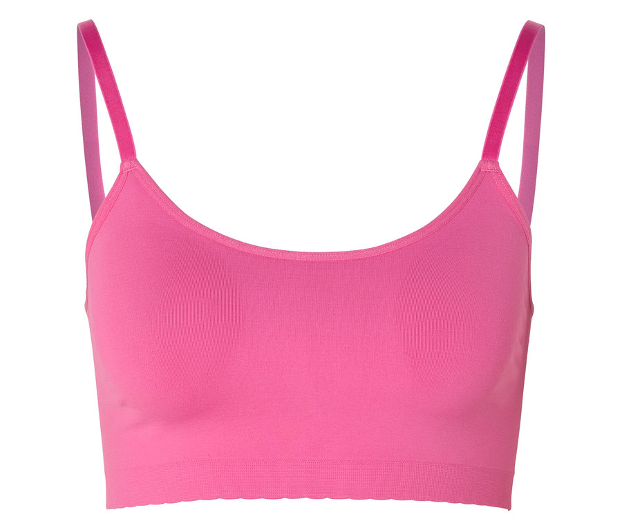 Brassière sans coutures rose vif avec dentelle et fines bretelles sur fond blanc.