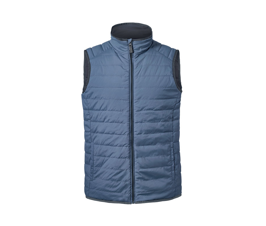 Gilet matelassé et réversible bleu avec fermeture éclair noire.