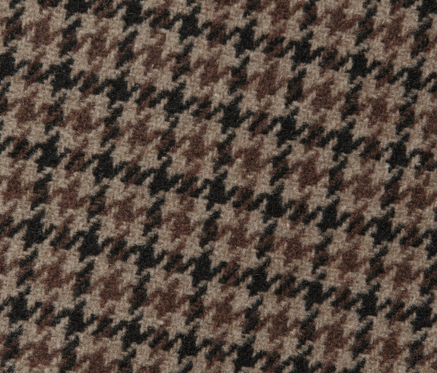 Gros plan sur une veste à carreaux avec de la laine.