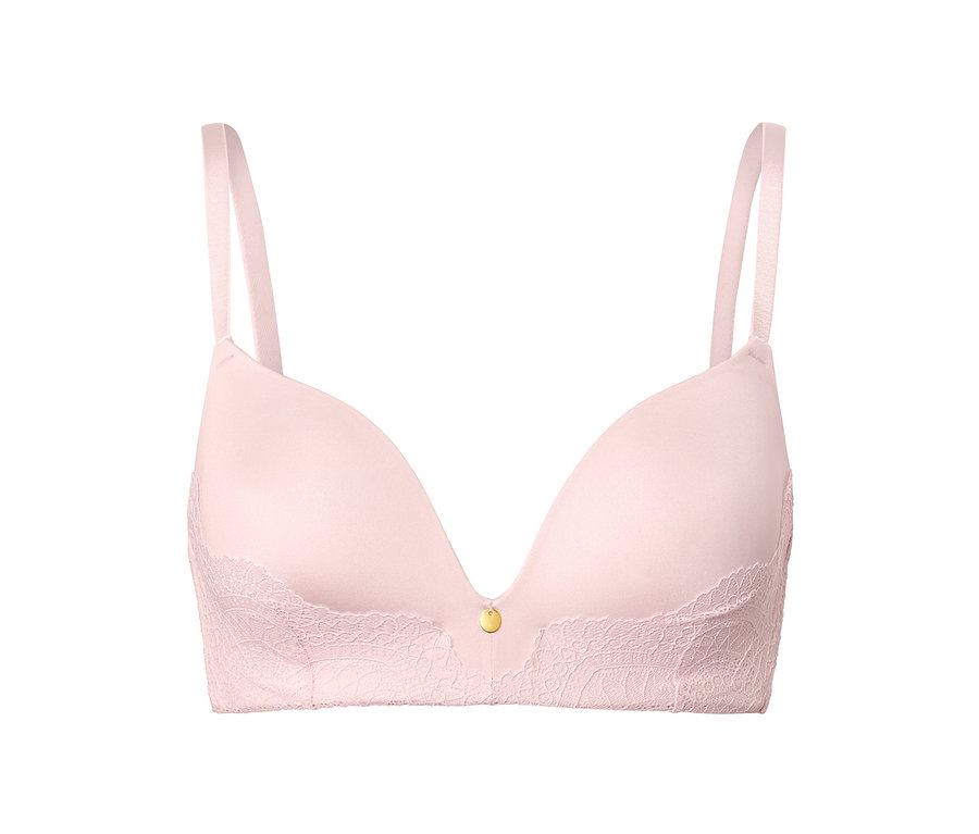 Soutien-gorge rose à coques souples sur fond blanc.