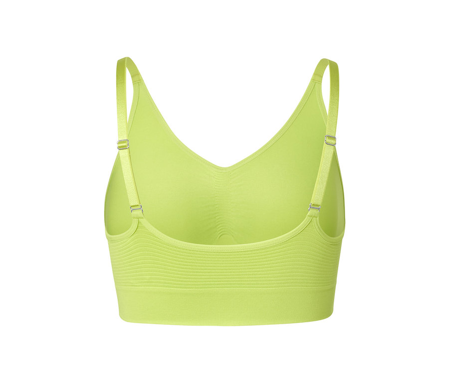 Vue détaillée de dos d'une brassière de sport sans coutures verte.