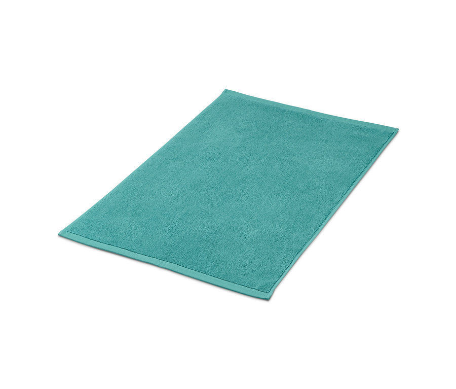 Tapis de douche turquoise.