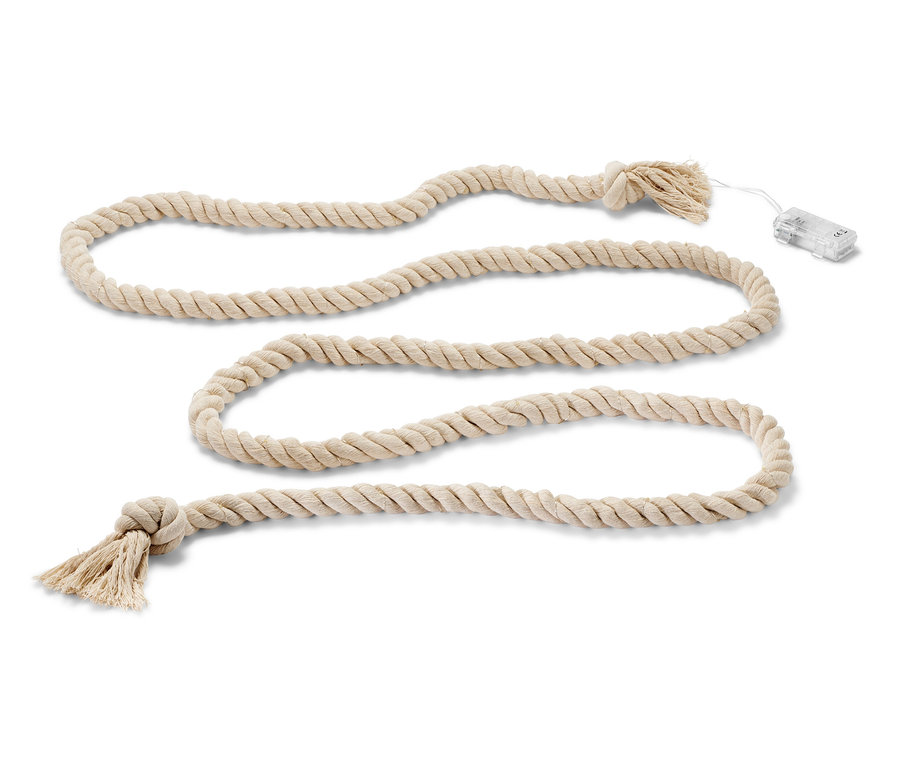 Une guirlande lumineuse à LED « cordage » enroulée en boucles sur un fond blanc.