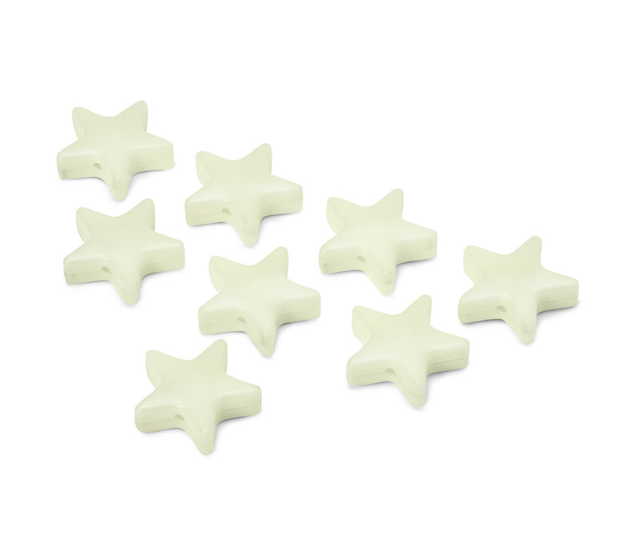 Huit clips de marquage brillant dans l’obscurité en forme d’étoile sont posés sur une surface blanche.