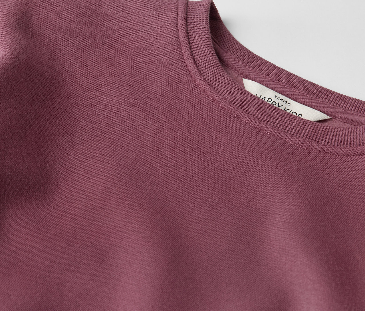 Gros plan sur une Kinder-Sweatkleid.