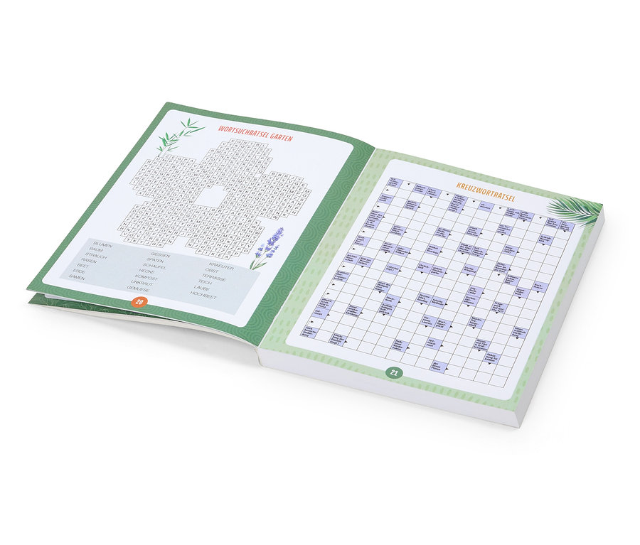 Cahier de puzzles ouvert avec des mots cachés et des mots croisés sur le thème du jardin.