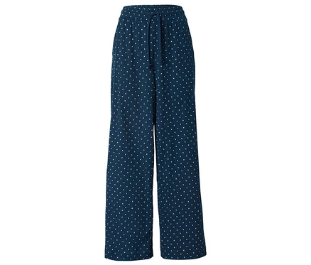 Pantalon large bleu marine à pois blancs avec cordon de serrage.