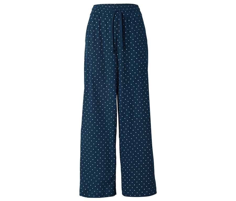Pantalon large bleu marine à pois blancs avec cordon de serrage.