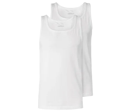 Deux débardeurs blancs sont posés l'un sur l'autre.