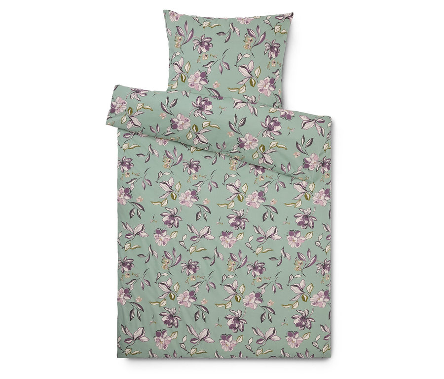 Ensemble de literie avec motif floral sur fond menthe, comprenant une taie d'oreiller.