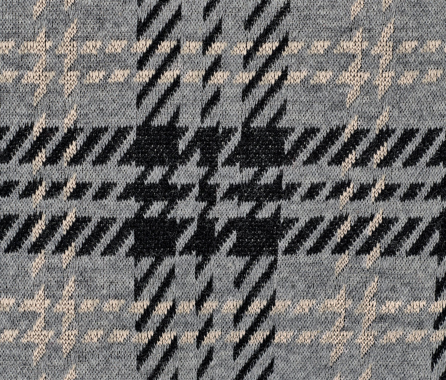 Gros plan d'un sweat-shirt à carreaux.