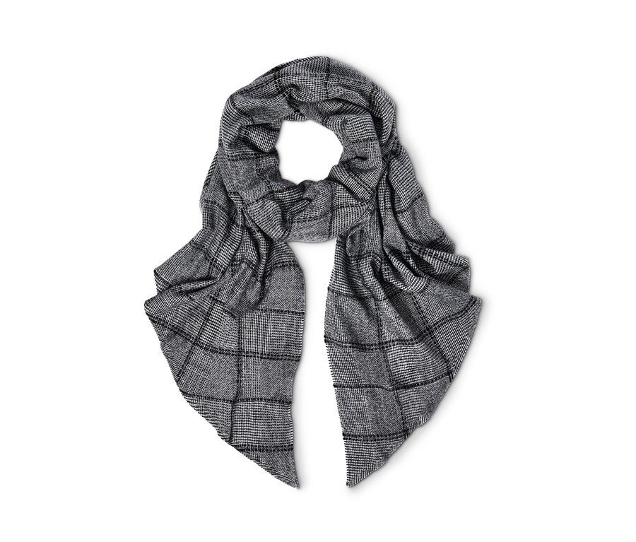 Une écharpe tissée XXL à motif carreaux.