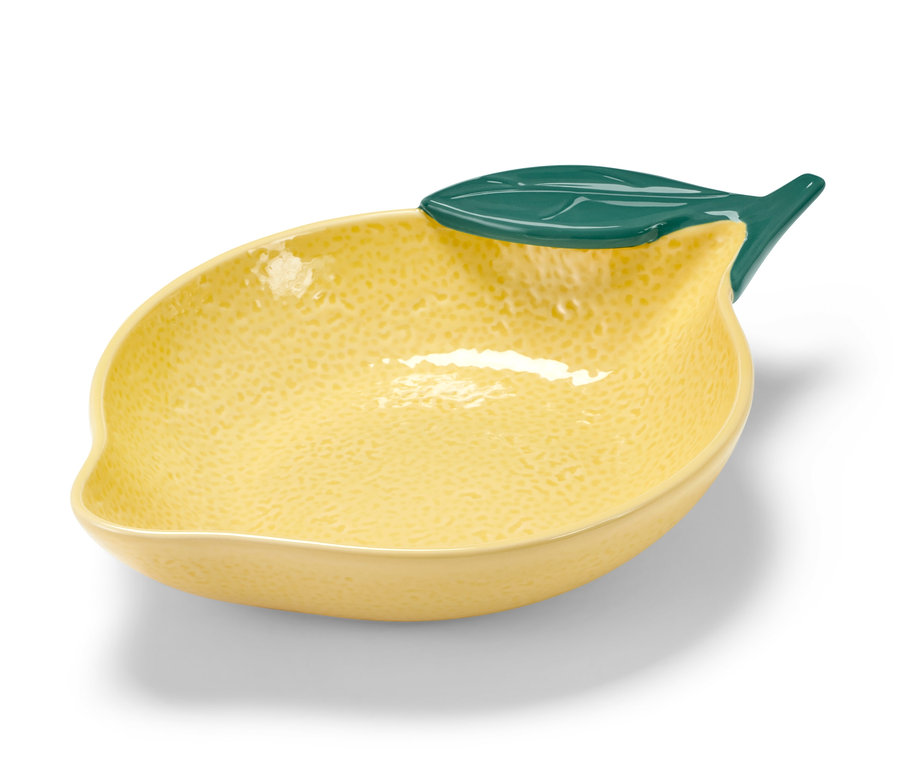 Coupelle jaune en forme de citron avec une feuille verte.