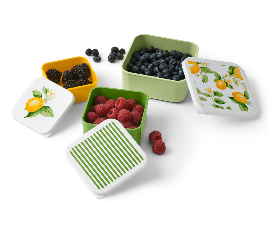 Récipients carrés dans les tons de vert, jaune et citron vert avec des fruits et des couvercles à motifs de citron et de rayures.