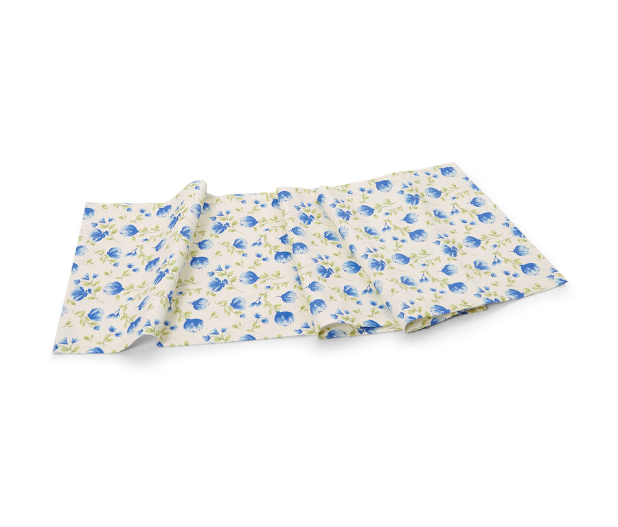 Chemin de table en coton avec motif floral bleu.