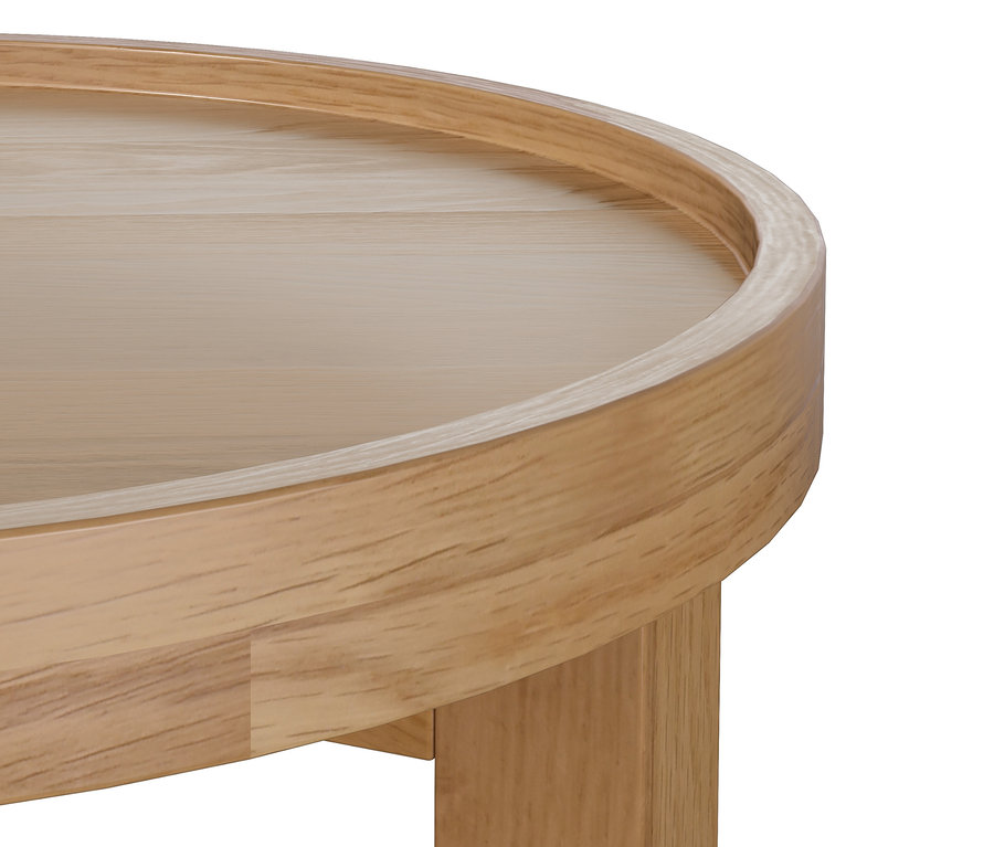 Détail d'une table d'appoint ronde en bois clair.