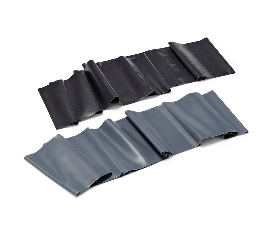 Deux bandes de fitness, une noire et une grise, sont posées côte à côte sur un fond blanc.