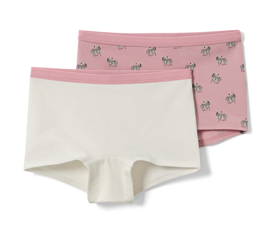 Deux culottes pour enfant, une blanche et une rose avec des zèbres.