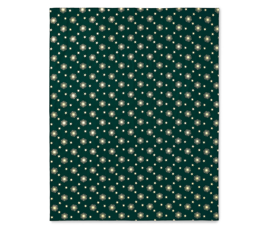 Une couverture vert foncé avec un motif d'étoiles et de soleils.