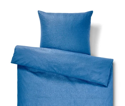 Parure de lit en seersucker bleue taille normale avec oreiller.
