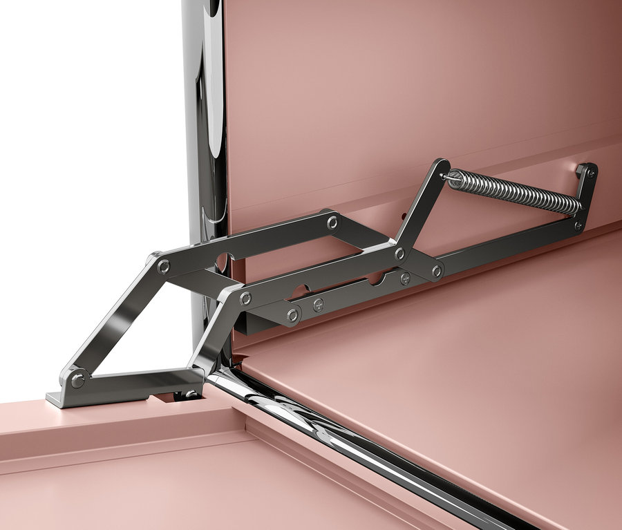 Détail du mécanisme d'ouverture du couvercle à l'intérieur d'un meuble avec des surfaces roses.