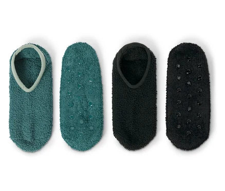 Deux paires de chaussettes antidérapantes : une paire turquoise et une paire noire.